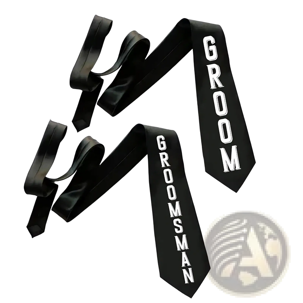 Black satin groom and groomsman sashes with bold white lettering in a groom tie and sash wedding set