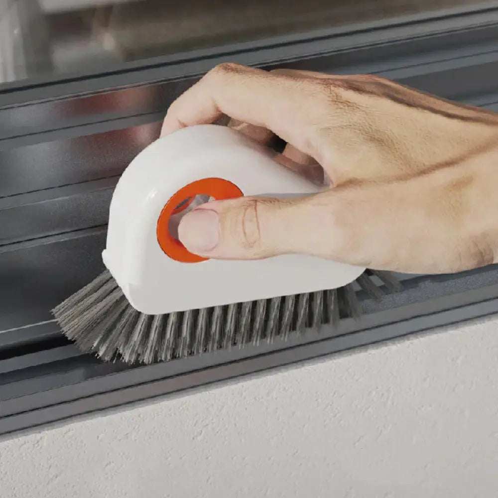 White and orange Arbaglobal Slim Groove and Window Track Cleaning Brush with metal bristles for detailed scrubbing