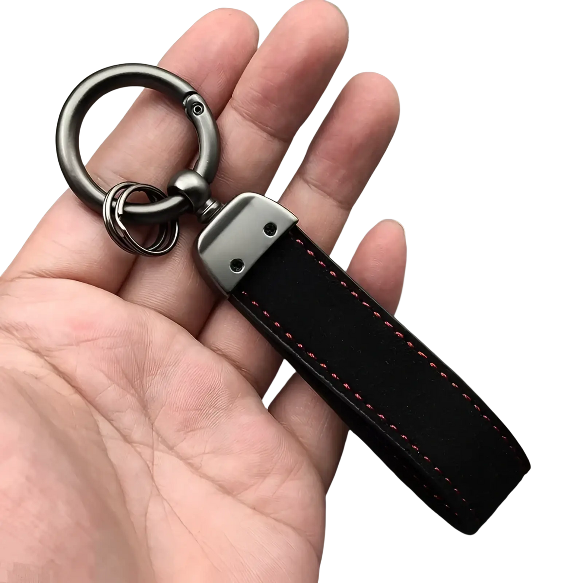 Gt Line suede leather car keychain in black with red stitching and a metallic carabiner clip for secure attachment