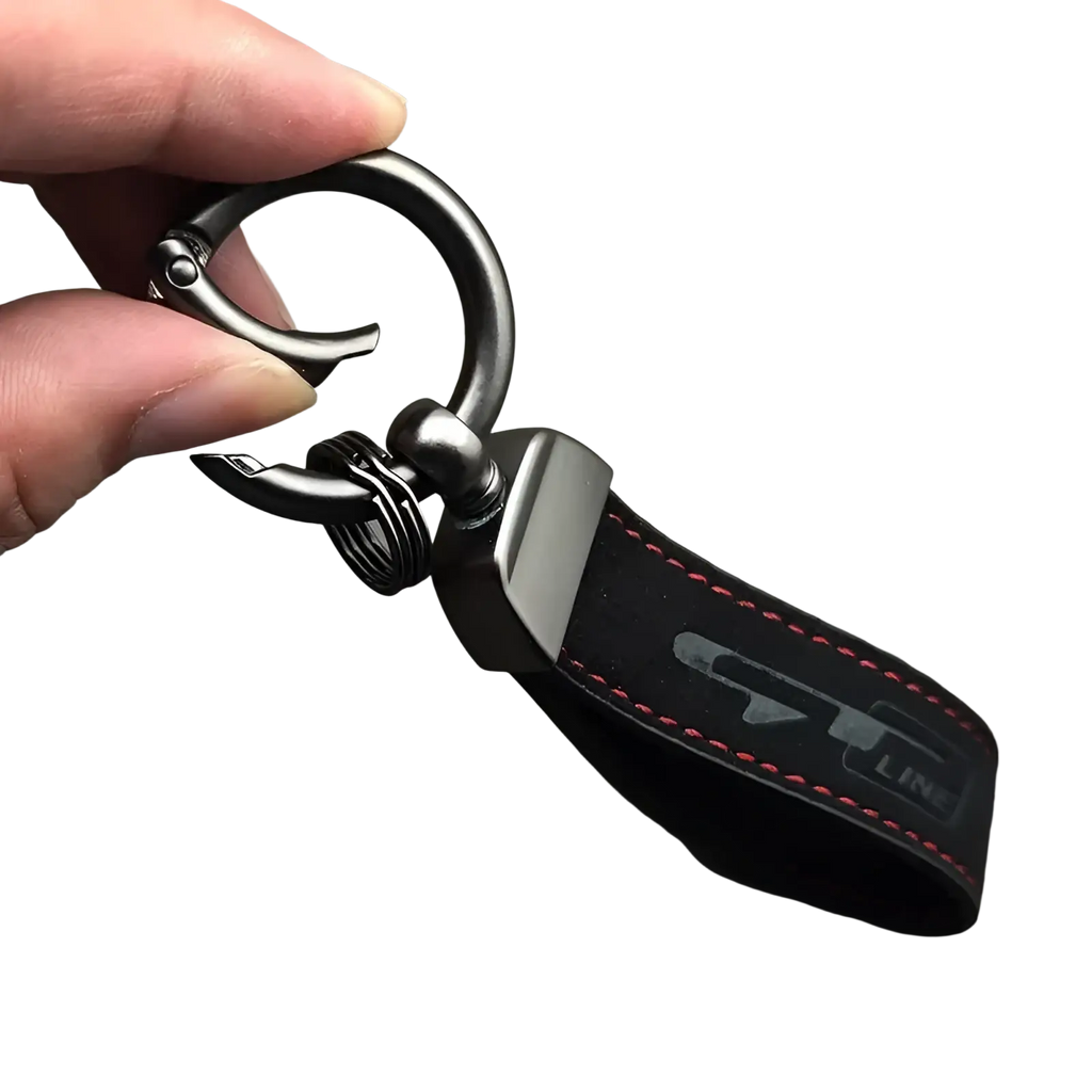Gt Line suede leather car keychain in black with red stitching and silver logo featuring matte black ring and clasp