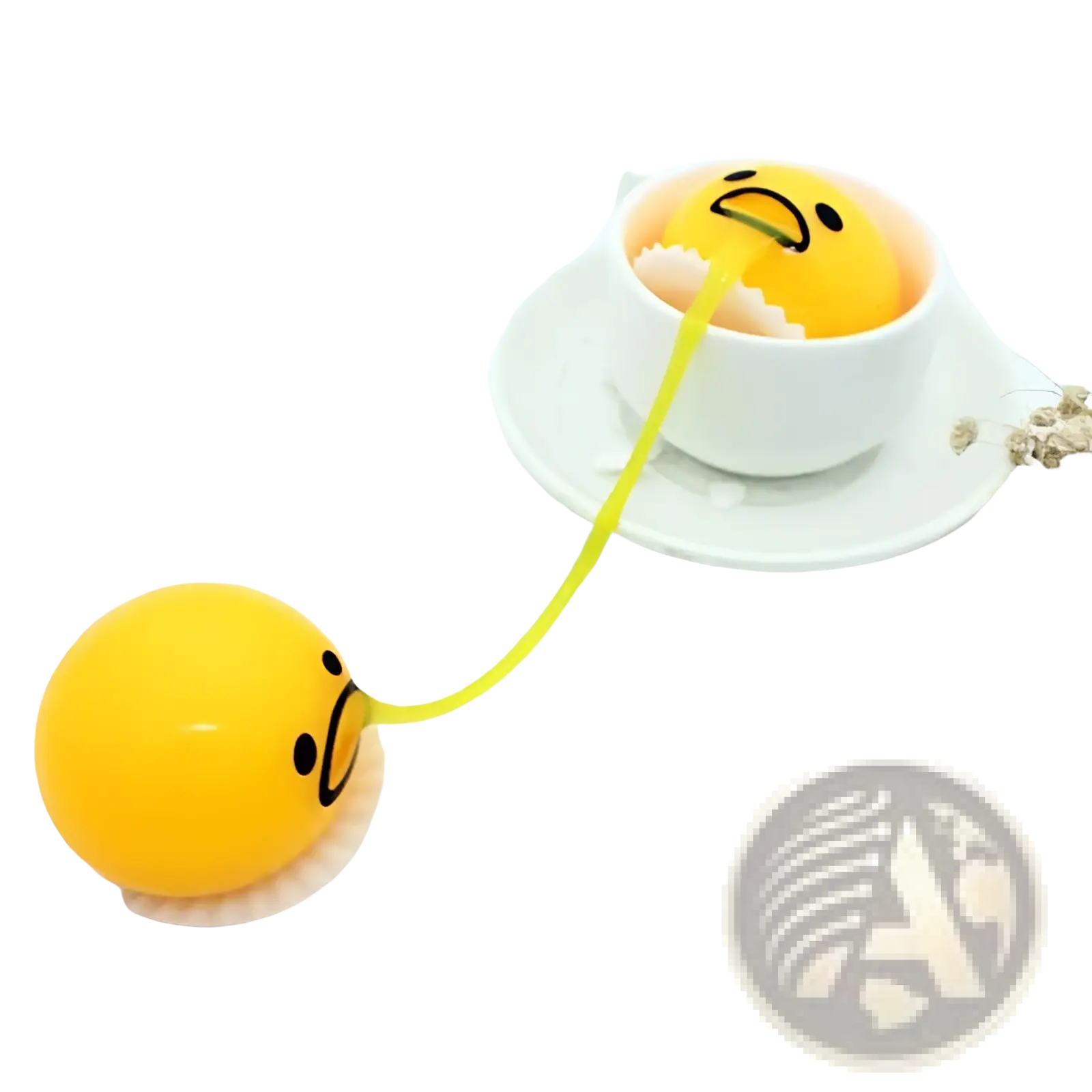 Yellow gudetama egg-shaped stress ball with sad face connected by elastic band inside white teacup for stress relief toy