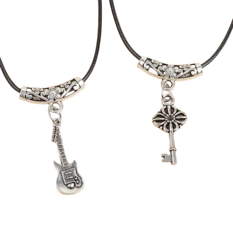 Silver-toned guitar and key pendant black cord necklace for women with ornate metal clasps