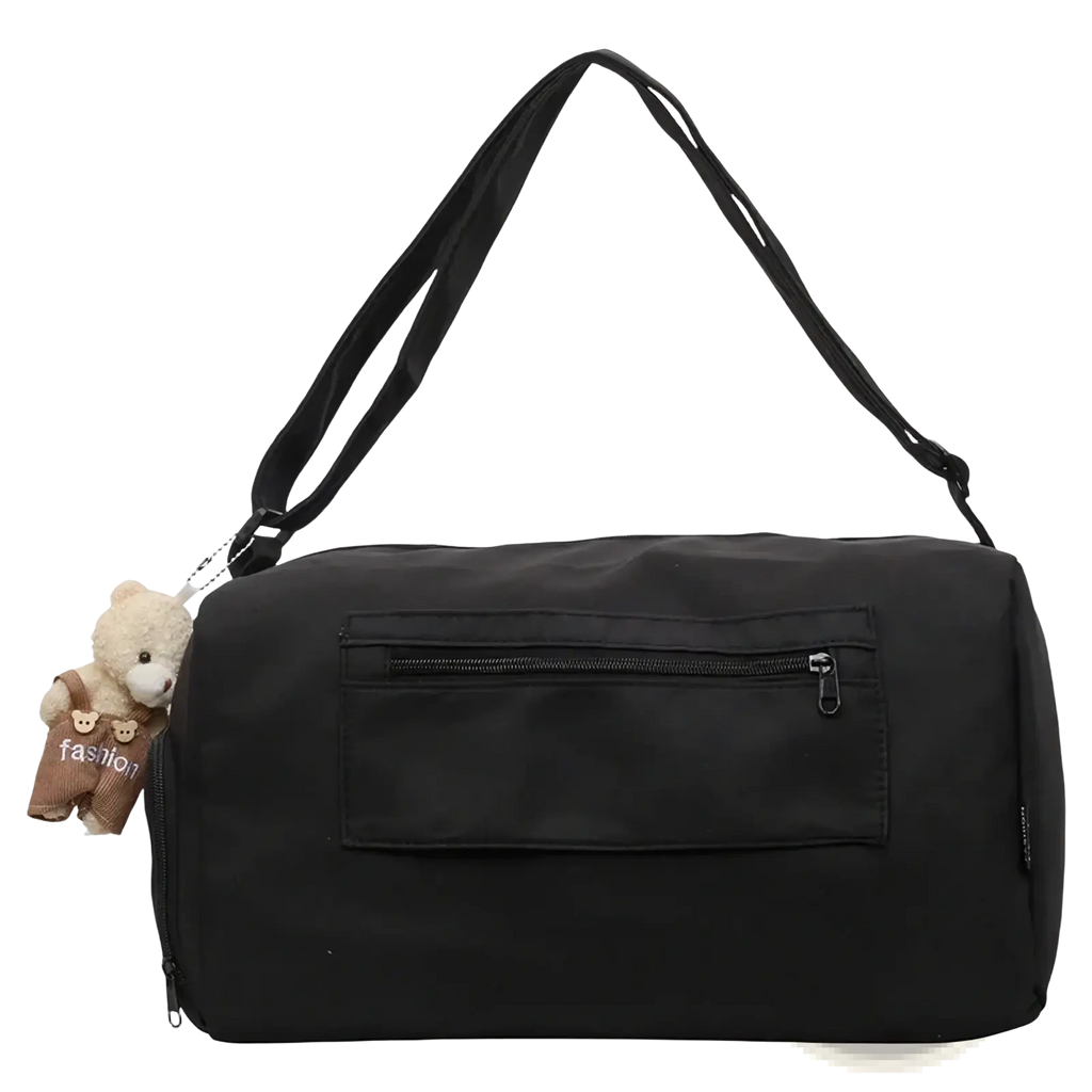 Black nylon gym duffle bag with detachable shoulder strap and beige teddy bear charm for travel and daily use