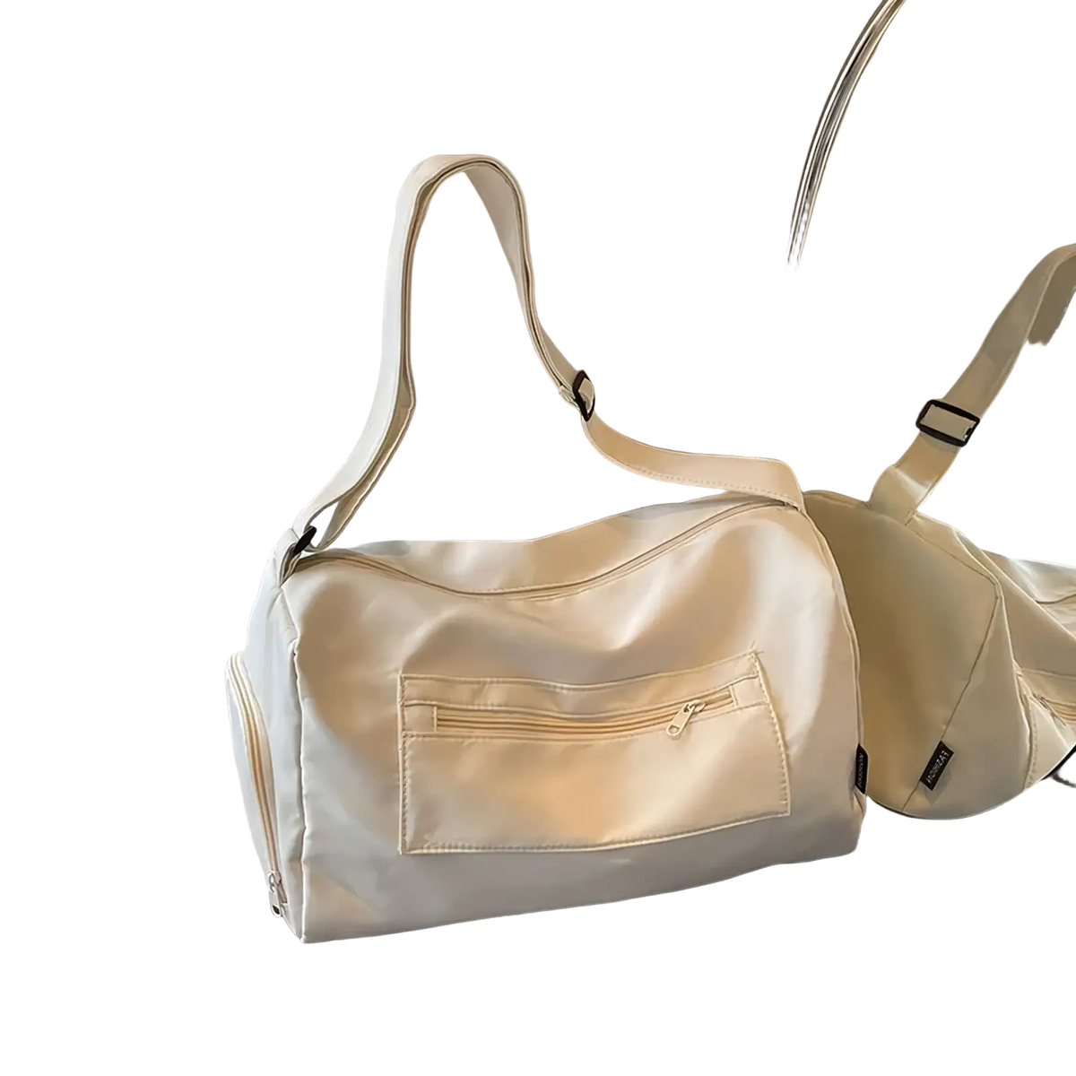 Cream-colored nylon gym duffle bag with front zippered pocket and adjustable shoulder strap for travel use