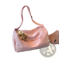 Pink nylon gym duffle bag with plush teddy bear keychain suitable for travel and featuring a mint green travel pillow bag