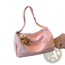 Pink nylon gym duffle bag with plush teddy bear keychain suitable for travel and featuring a mint green travel pillow bag