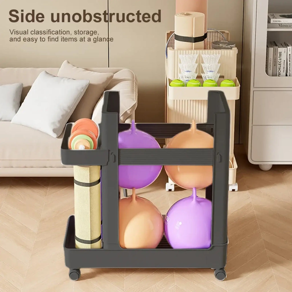 Black plastic gym equipment organizer trolley with wheels and multiple compartments holding colorful exercise balls