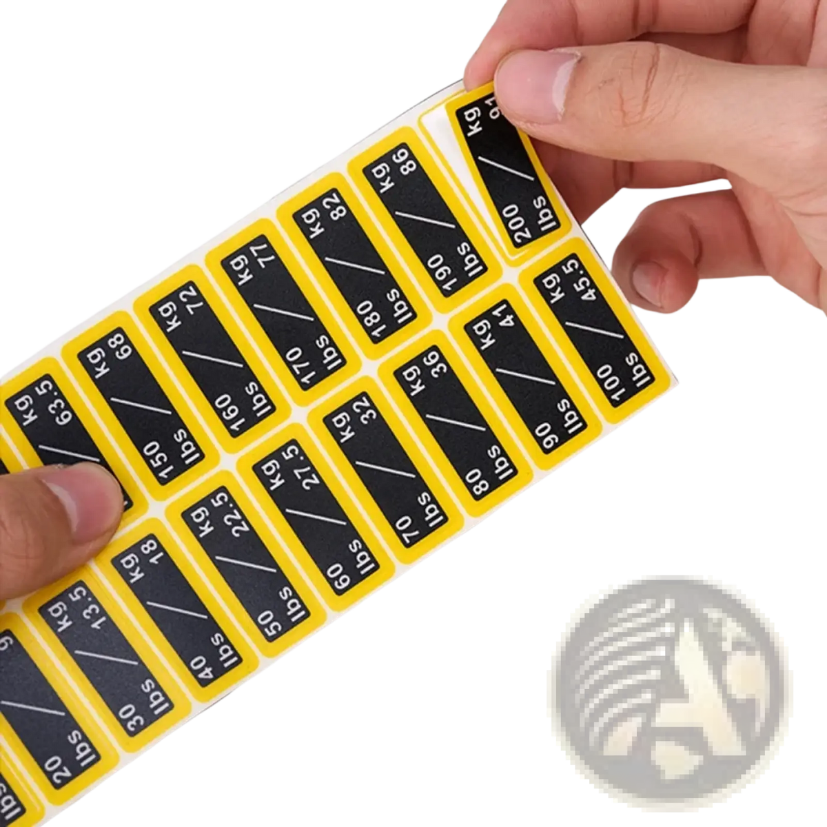 A sheet of yellow and black gym weight stack labels with bold lbs and kg text for dual unit fitness conversion