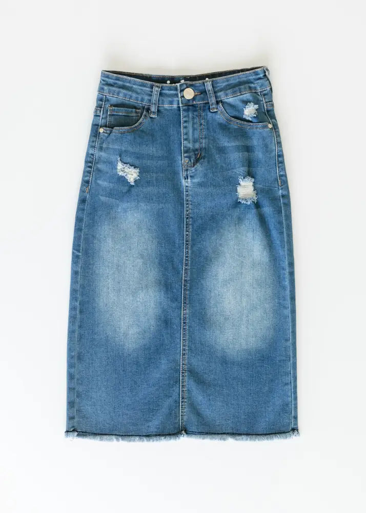 Hadley high rise distressed denim midi skirt in blue with frayed hem and mid-rise fit