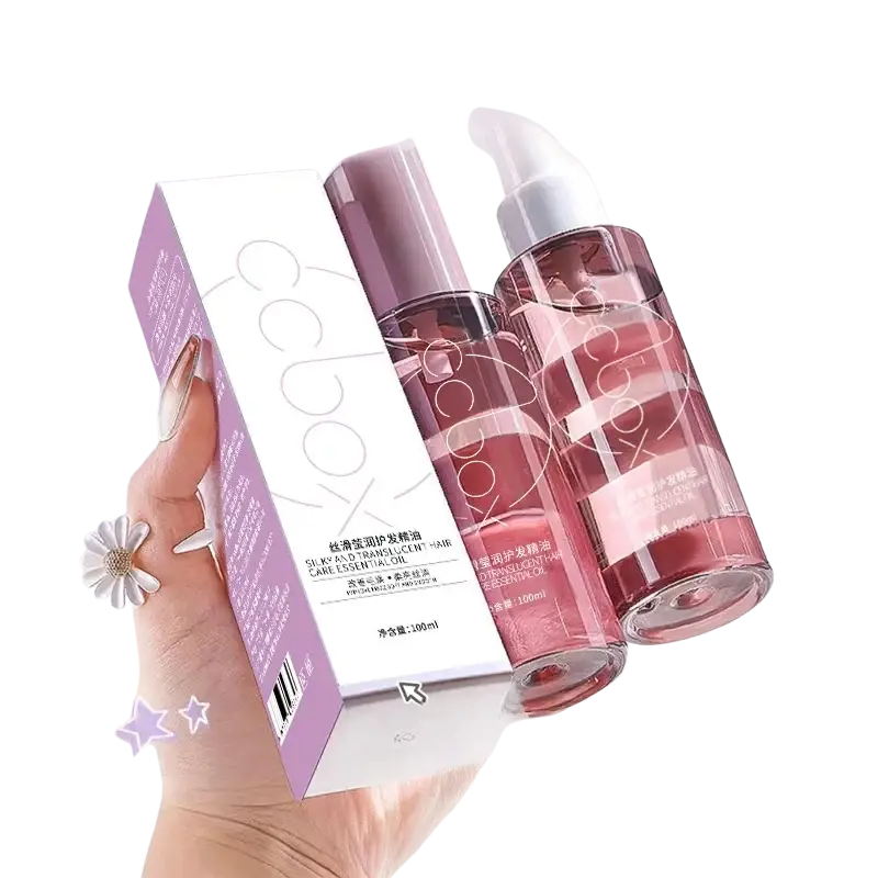 A hand holds a 100ml hair care essential oil bottle with pink liquid and purple spray beside minimalist cocoon packaging
