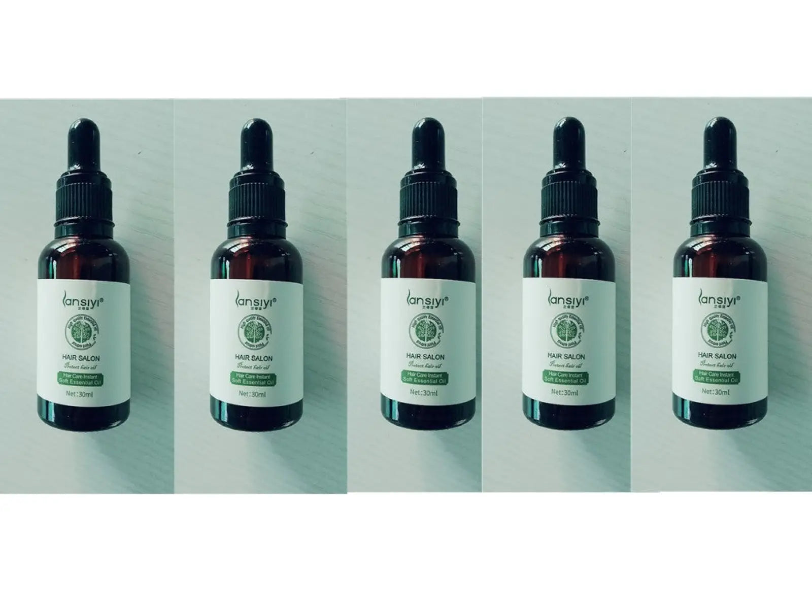 Five dark amber glass bottles of lansiyi hair care essential oil salon protect 30ml with black dropper caps and white labels