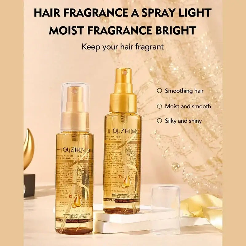 Two golden Ouzhin hair care essential oil spray bottles for luster and repair in taller and shorter sizes