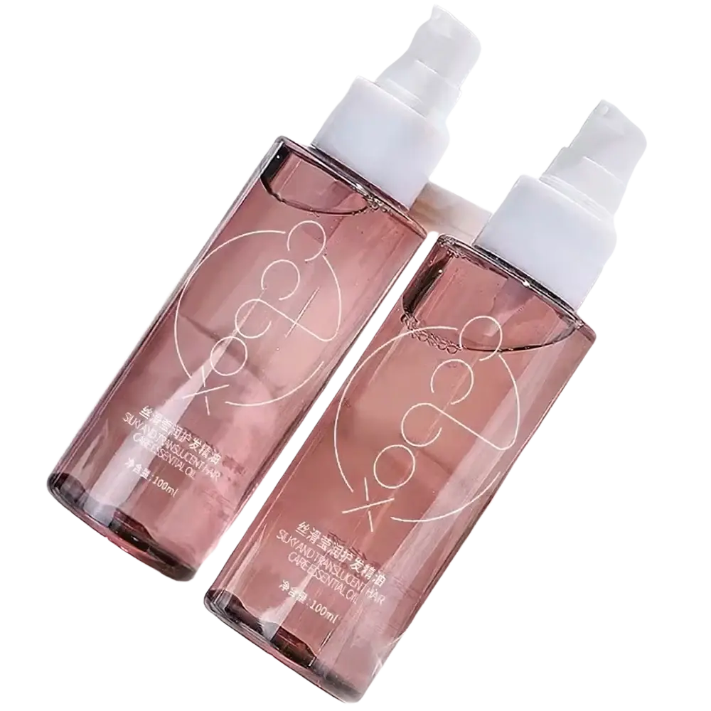 Two translucent rose-gold spray bottles with white caps featuring minimalist silver logos for hair care nourishing repair formula