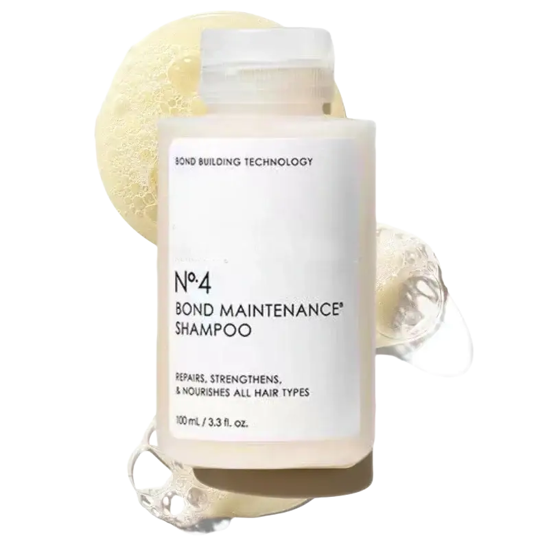A clear rectangular bottle of hair care series frizz repair split ends shampoo with white label and transparent cap
