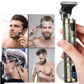 Gold-colored electric hair clippers professional t blade trimmer for men with intricate engraved patterns and digital display