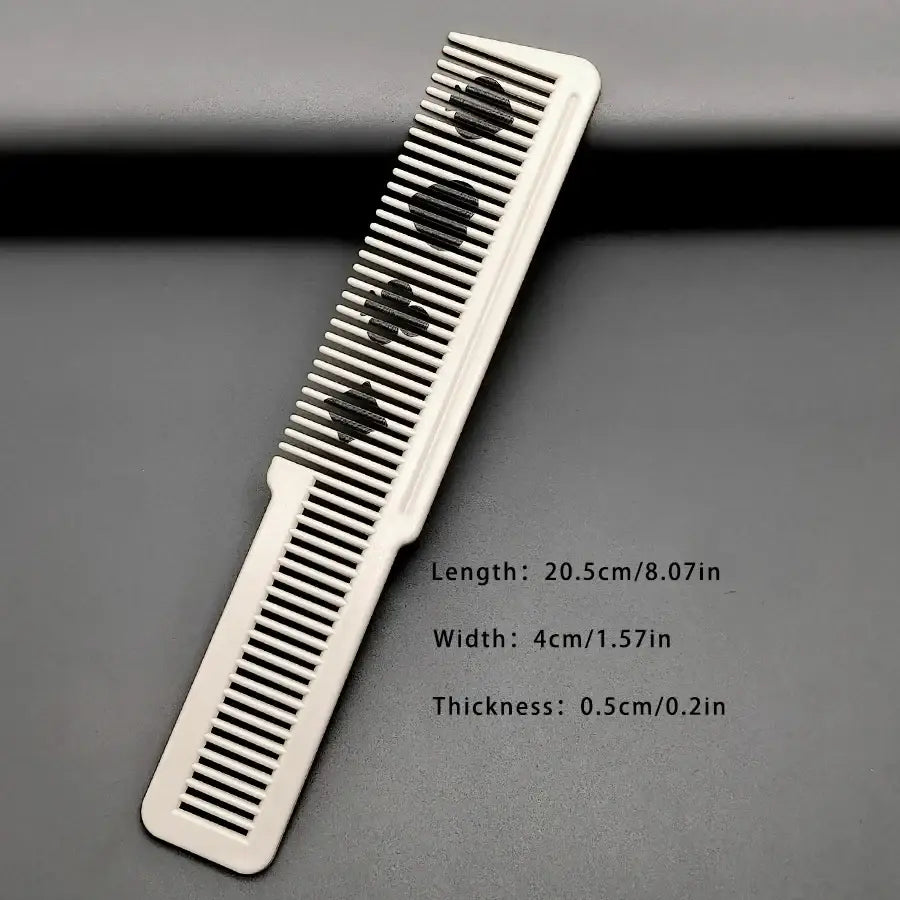 White resin hair cutting comb with black spade symbols on teeth for styling and grooming purposes