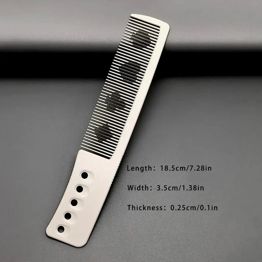 White plastic hair cutting comb with black spade-shaped inlays made of resin styling tool
