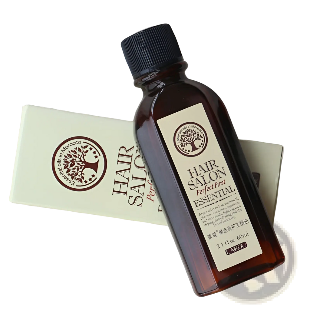 Dark amber glass bottle with black ribbed cap and white label featuring brown text, hair salon perfect first essential by lakou hair essential oil for damage repair and luster