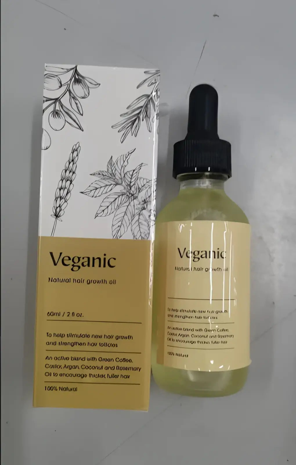 Veganic hair growth oil moisturizing repair serum 60ml in clear glass bottle with black dropper and amber liquid