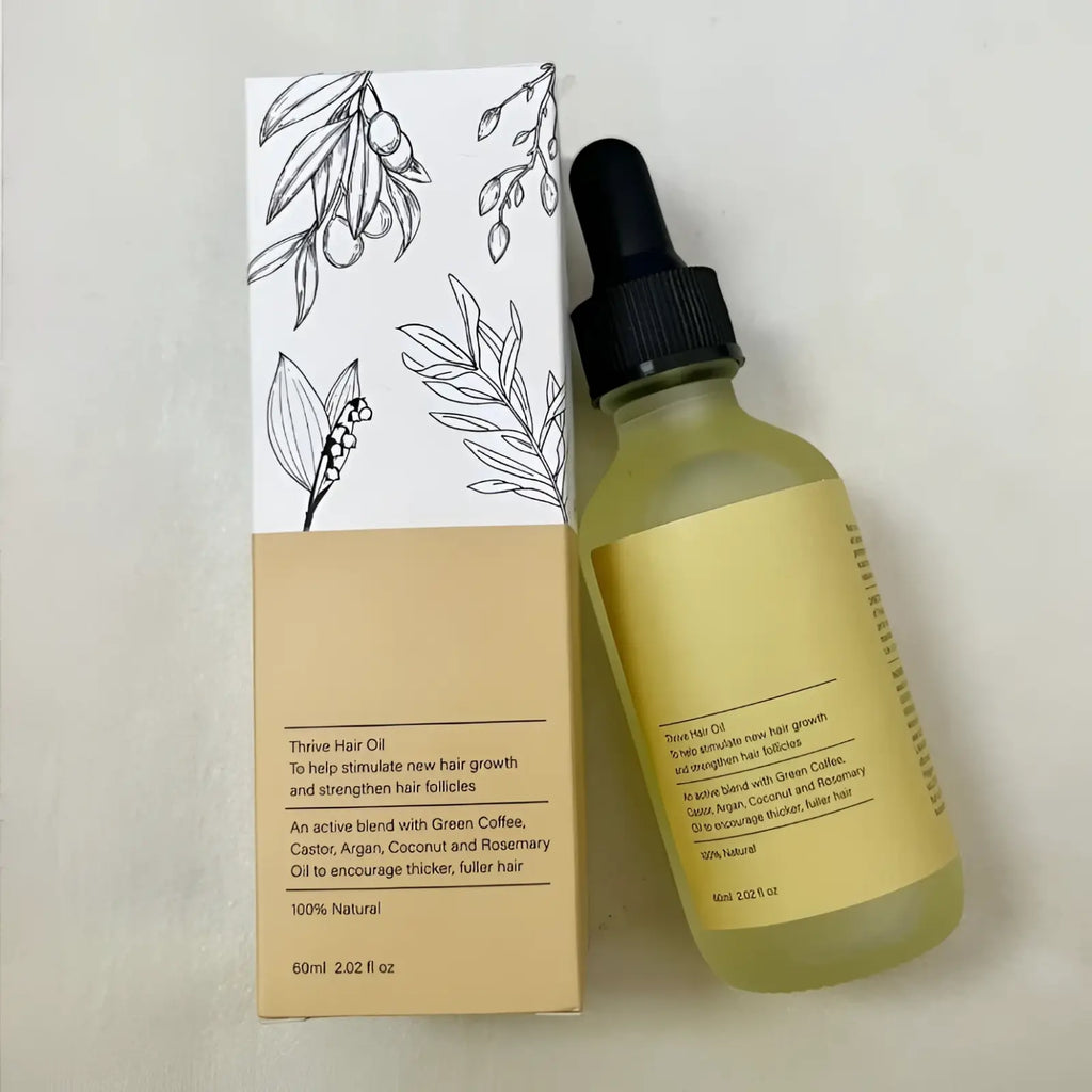 A clear glass bottle with black dropper containing light greenish yellow hair growth oil moisturizing repair serum 60ml