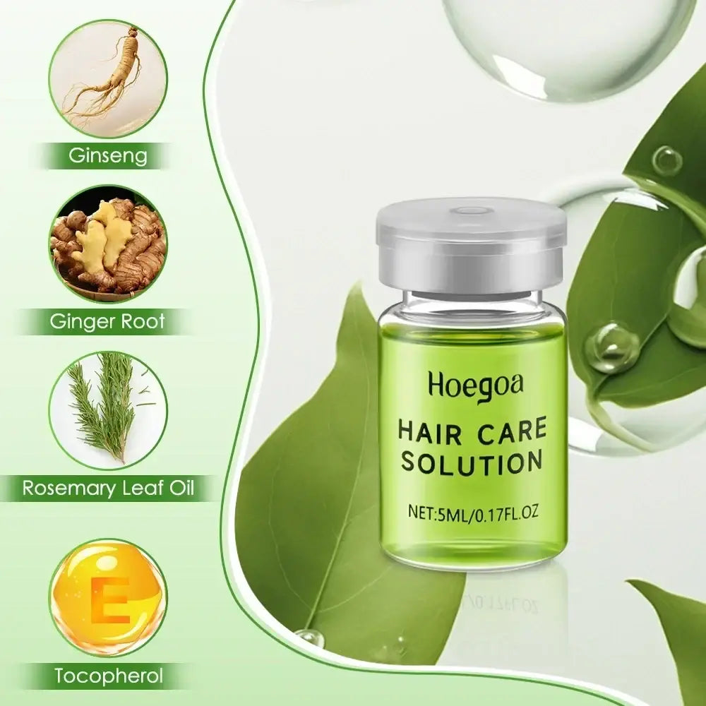 A clear glass vial with silver cap contains green hoegoa hair care solution 5ml surrounded by ginseng ginger rosemary and tocopherol for hair growth