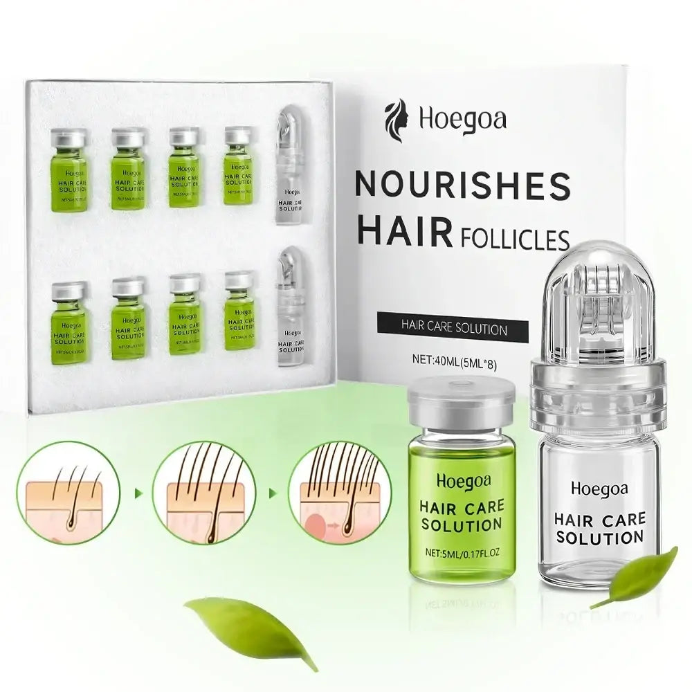 Hoegoa hair care solution hair growth serum in clear glass vials with green liquid and silver caps with roller device