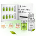 Hoegoa hair care solution hair growth serum in clear glass vials with green liquid and silver caps with roller device