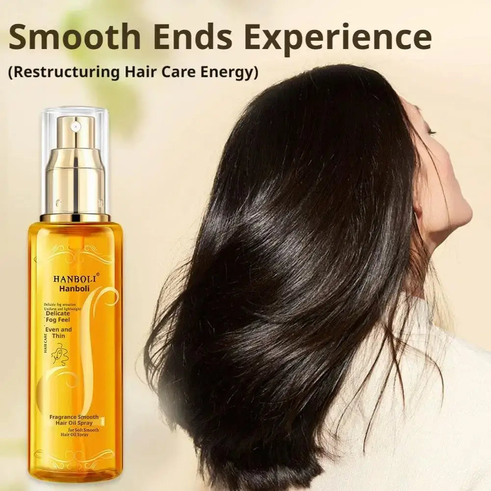Golden transparent glass hair oil spray bottle with gold-tone nozzle embossed with hanboli branding for frizz control and hydration