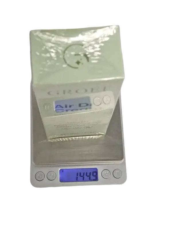 A pale green rectangular box of hair styling cream with nourishing formula for air dry styling 120g