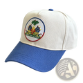 Cream-colored baseball cap with blue brim and embroidered Haitian flag patch for sun protection