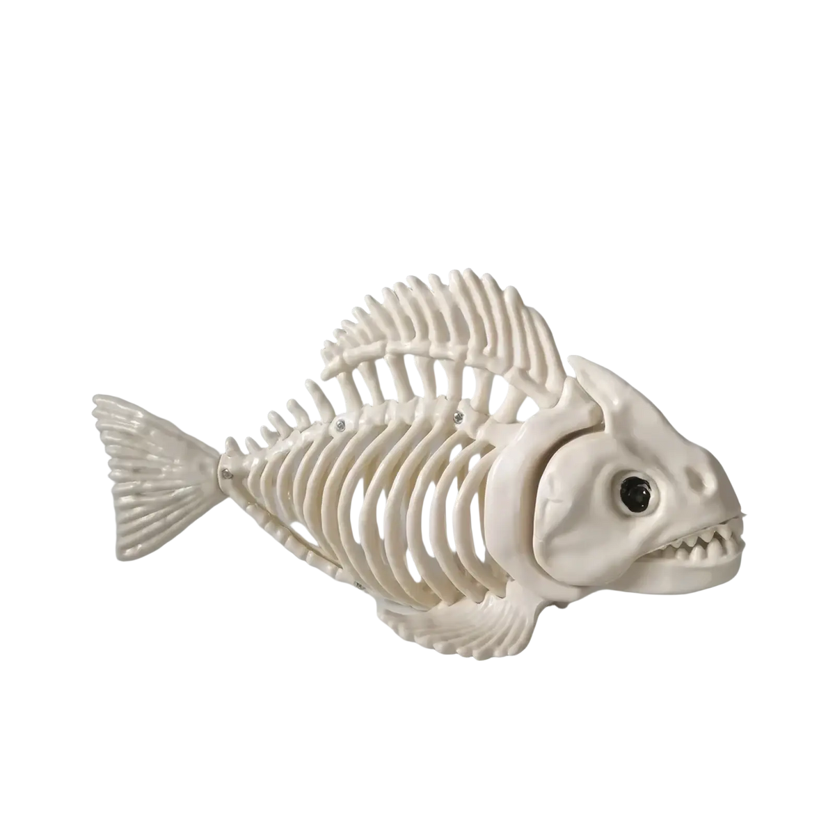 White plastic fish skeleton figurine with detailed bone structure and black eye from halloween animal skeleton props set