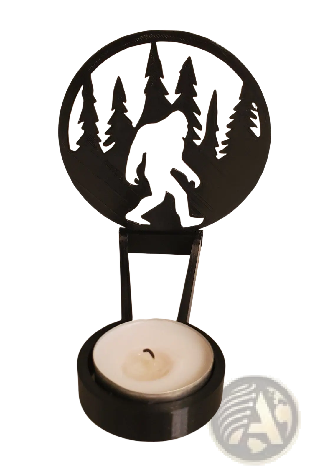 Black metal halloween bat candle holder with circular cutout featuring bigfoot silhouette walking through pine trees