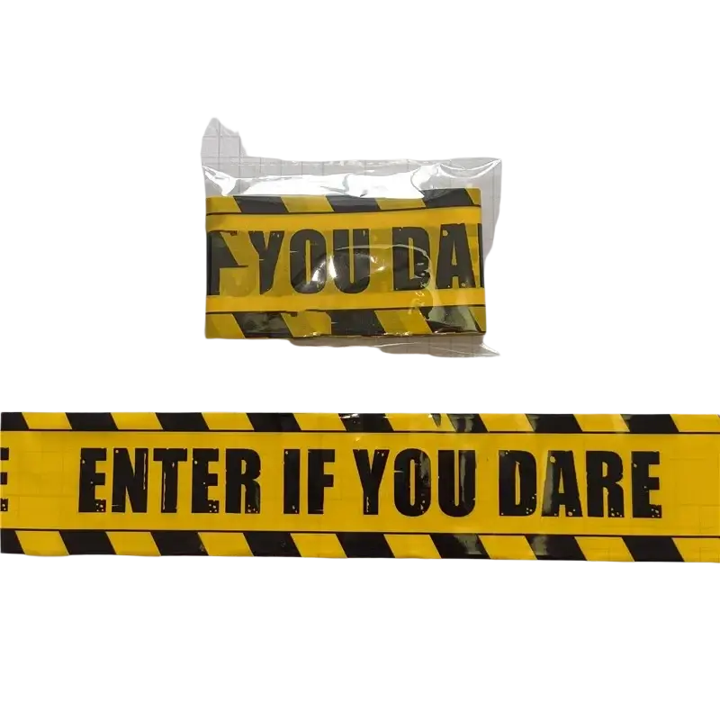 Yellow and black halloween caution tape with bold black enter if you dare text for spooky party warning barrier