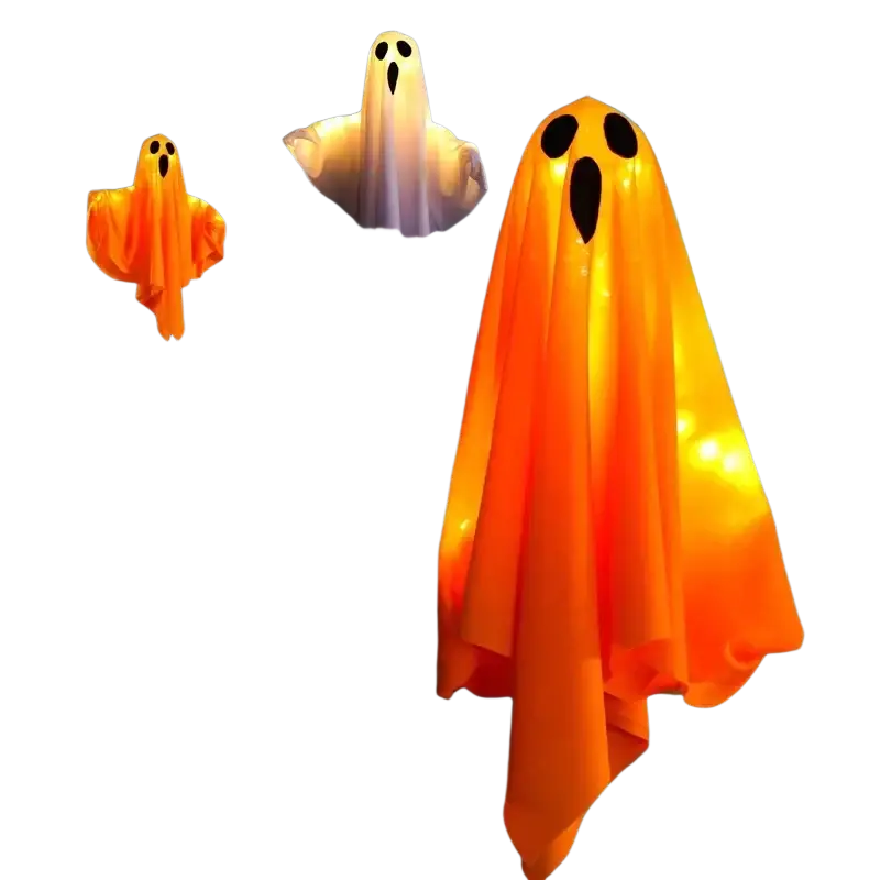 Orange glowing halloween decoration led ghost lanterns with black eye and mouth cutouts hanging in spooky scene