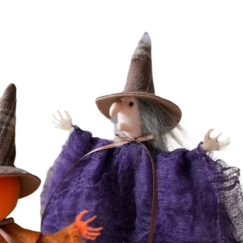 A plush halloween decoration witch hanging pendant with a brown hat gray yarn hair and purple mesh cape