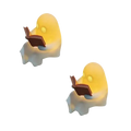 Yellow glowing ghost figurines holding open books in a halloween desktop luminous reading ghost ornament