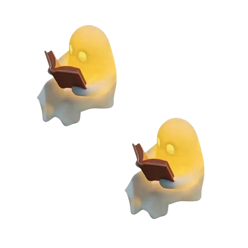 Yellow glowing ghost figurines holding open books in a halloween desktop luminous reading ghost ornament