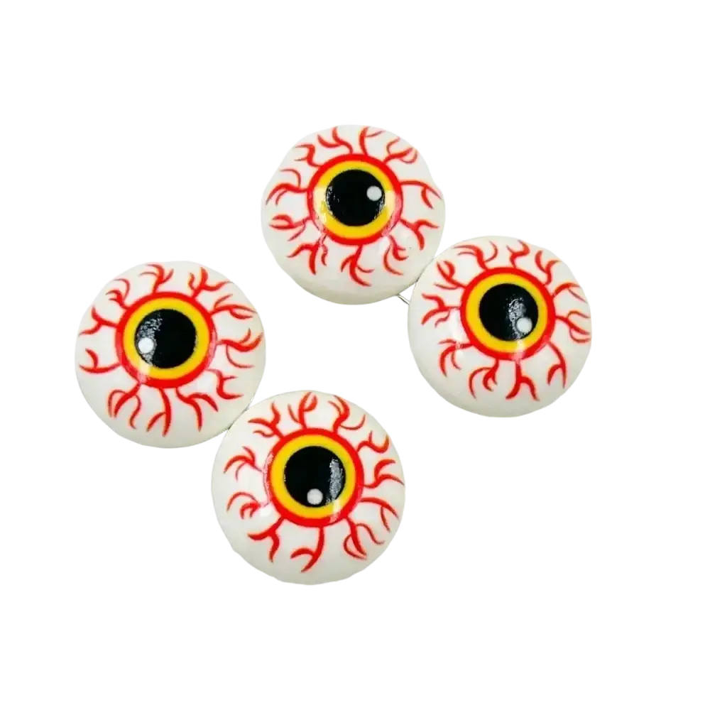 White plastic halloween eyeball ornaments with red blood vessel details and yellow orange irises for decoration