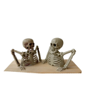 Two beige painted halloween half skeleton decoration figurines with detailed bone structures on wooden base for terrifying scene