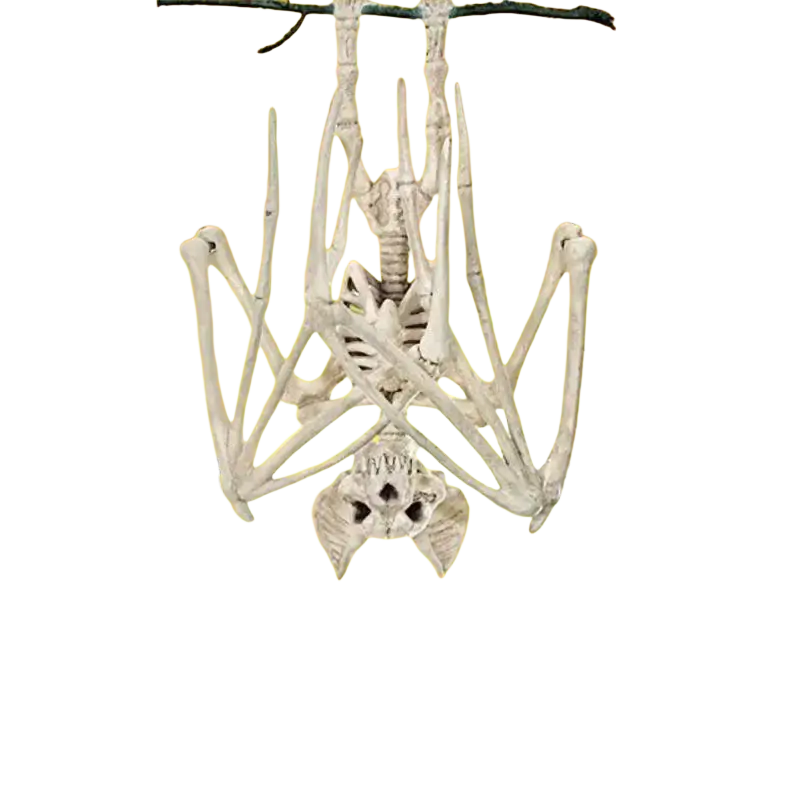 A white plastic skeleton hanging upside down from a branch with halloween pumpkins and haunted houses halloween decoration
