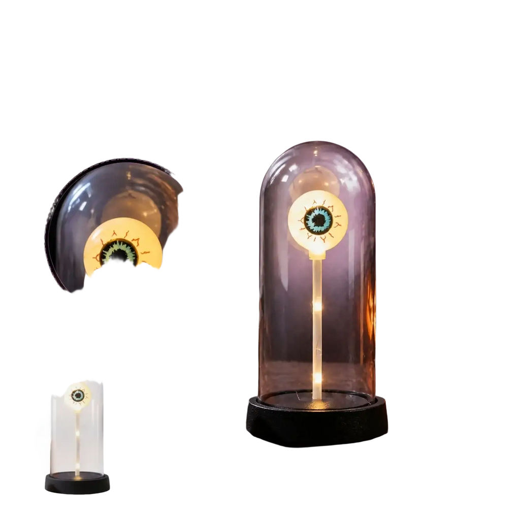 A glowing halloween lights decoration featuring a themed eye lamp in a clear glass dome with a black base