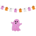 A glittery pink paper ghost decoration with black eyes in a halloween party glitter paper garland banner