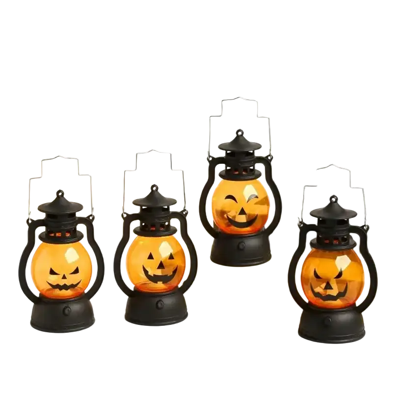 Set of four black metal halloween party lanterns with orange glass jack o lantern faces for halloween party decor