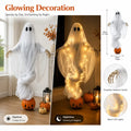 A translucent white Halloween pumpkin ghost light with poseable skeleton hands and warm LED lights for outdoor yard decoration