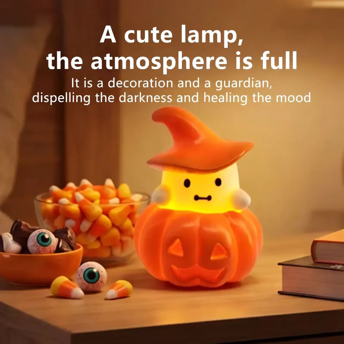 A glowing orange halloween pumpkin ghost night light ornament with a witch hat and friendly face made of smooth plastic
