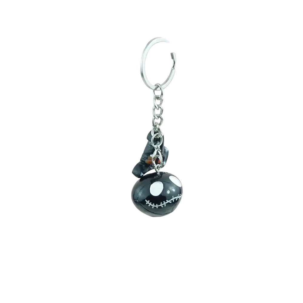 Black glossy resin pumpkin keychain with white stitched eyes and smile attached to silver chain and ring for halloween gift