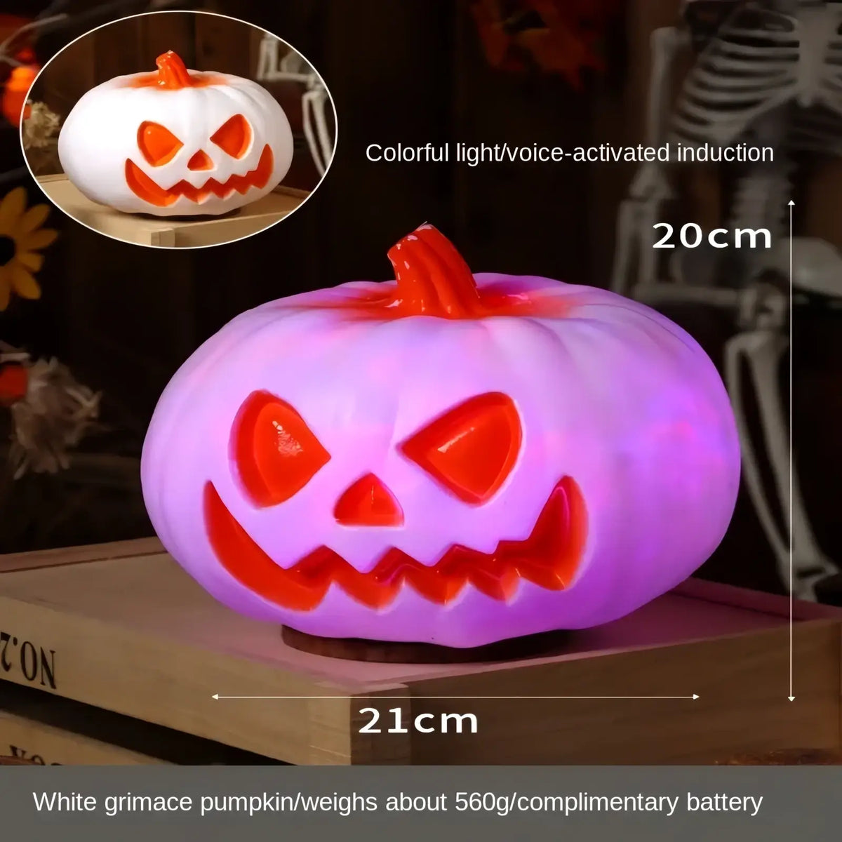 A glowing purple and orange halloween pumpkin lantern decoration with a carved grinning face and colorful voice-activated lights
