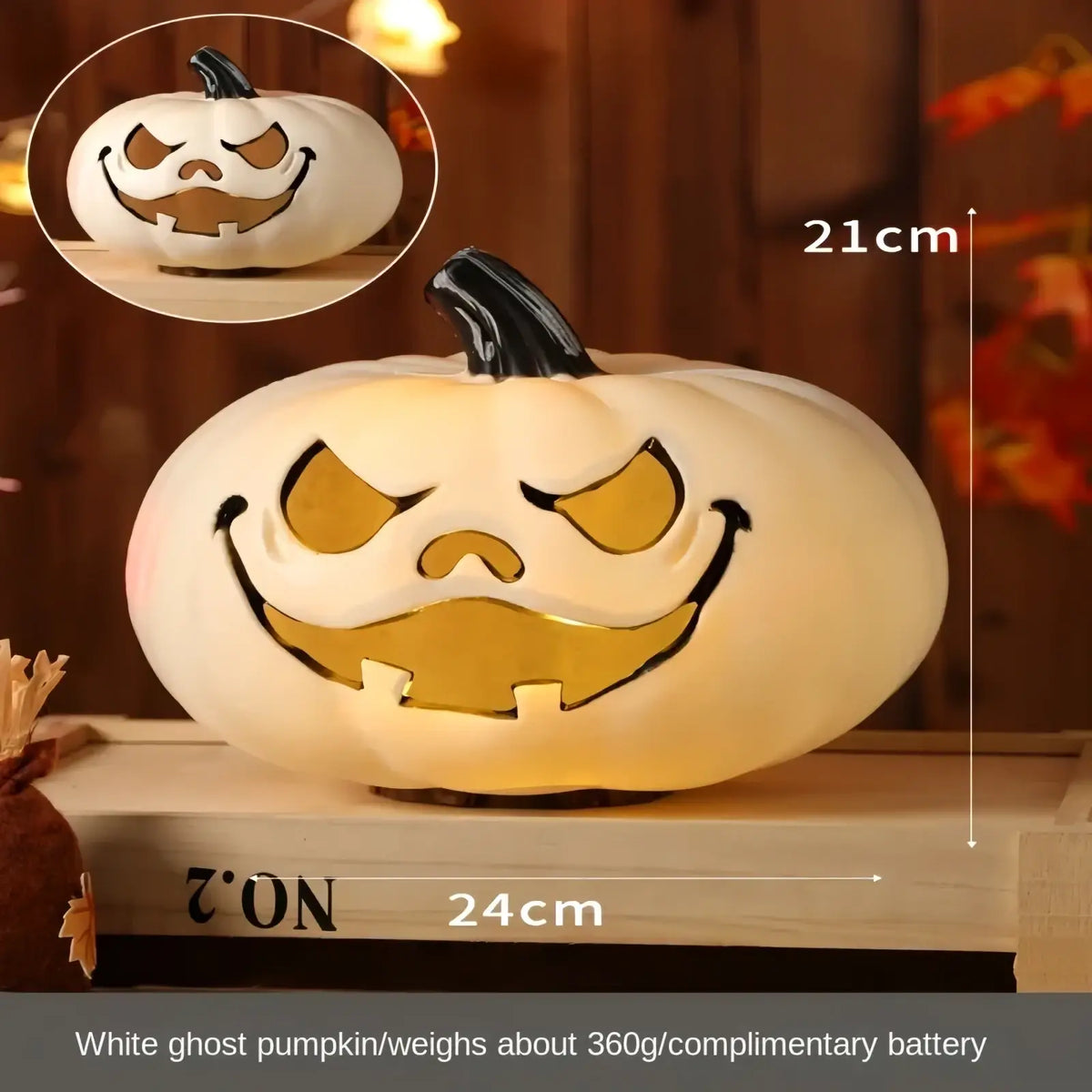 White illuminated Halloween pumpkin lantern decoration with carved smiling face and black stem for festive décor
