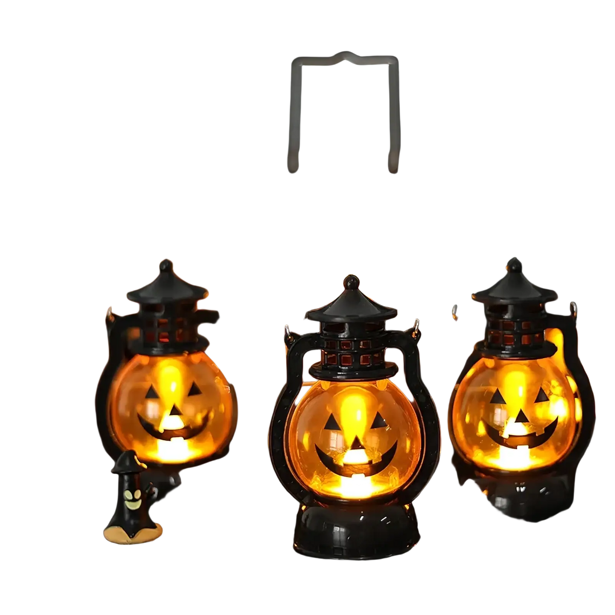 Set of four black plastic halloween pumpkin led lanterns with glowing orange faces for festive decoration