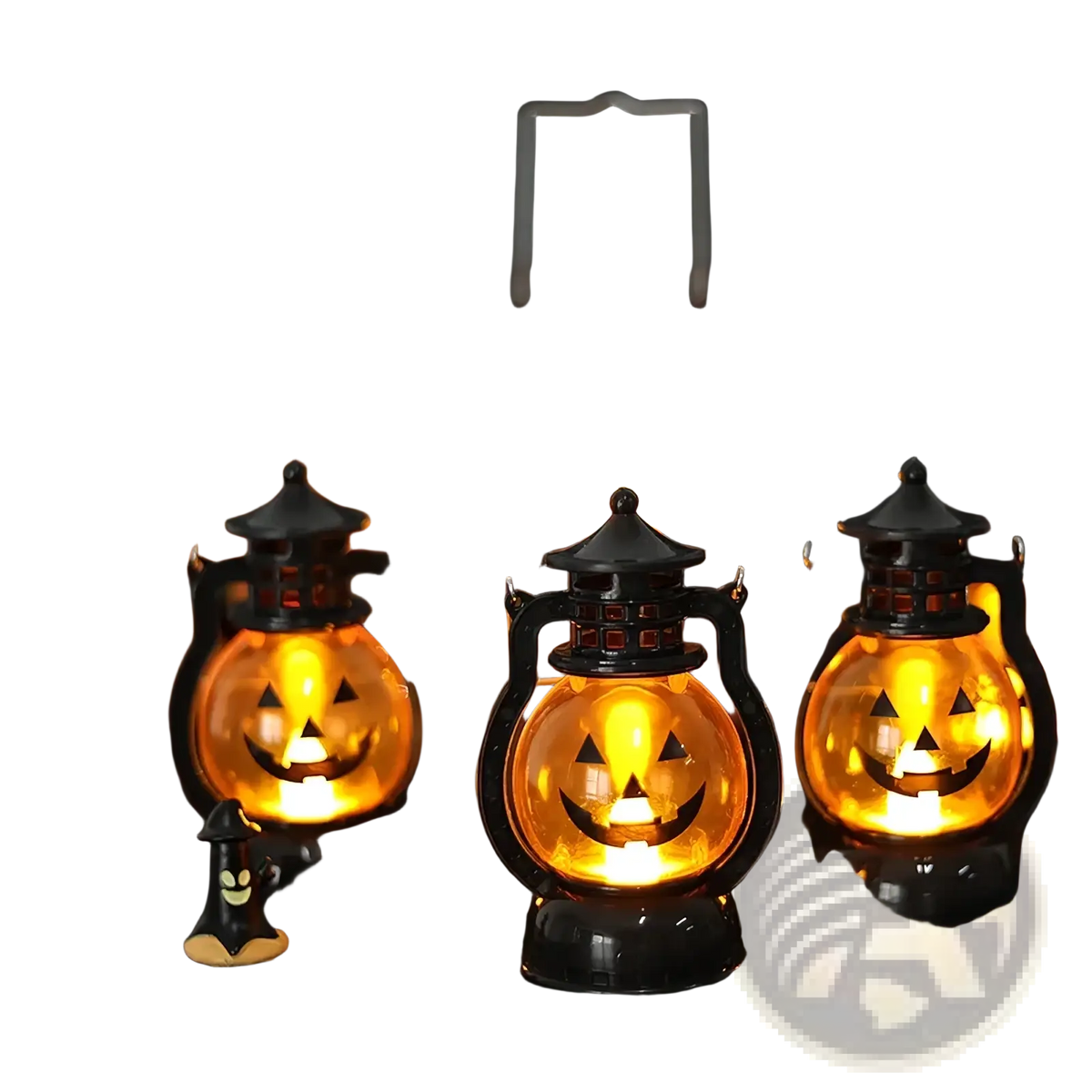 Set of four black plastic halloween pumpkin led lanterns with glowing orange faces for festive decoration